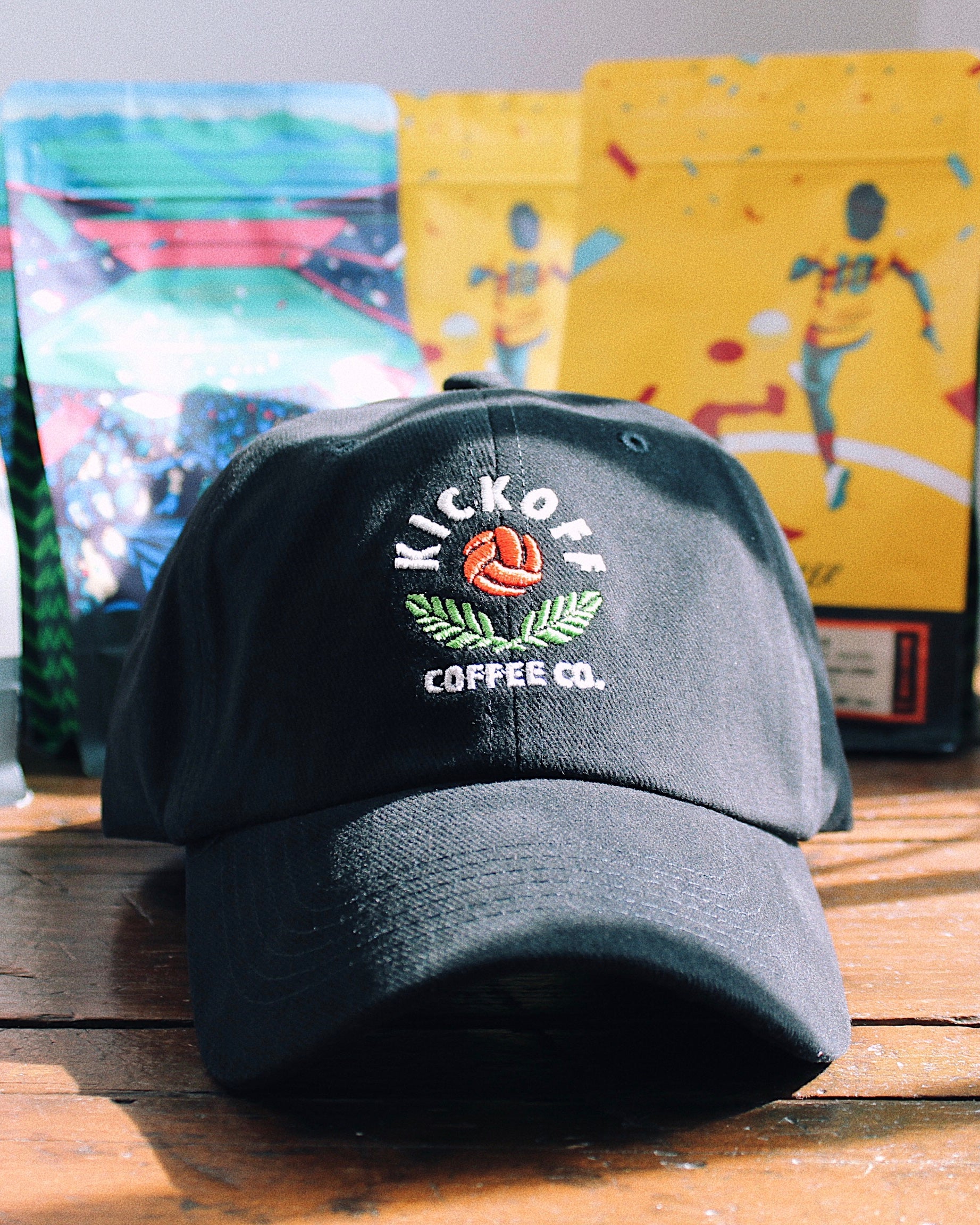 black cap with embroidered kickoff logo on the front